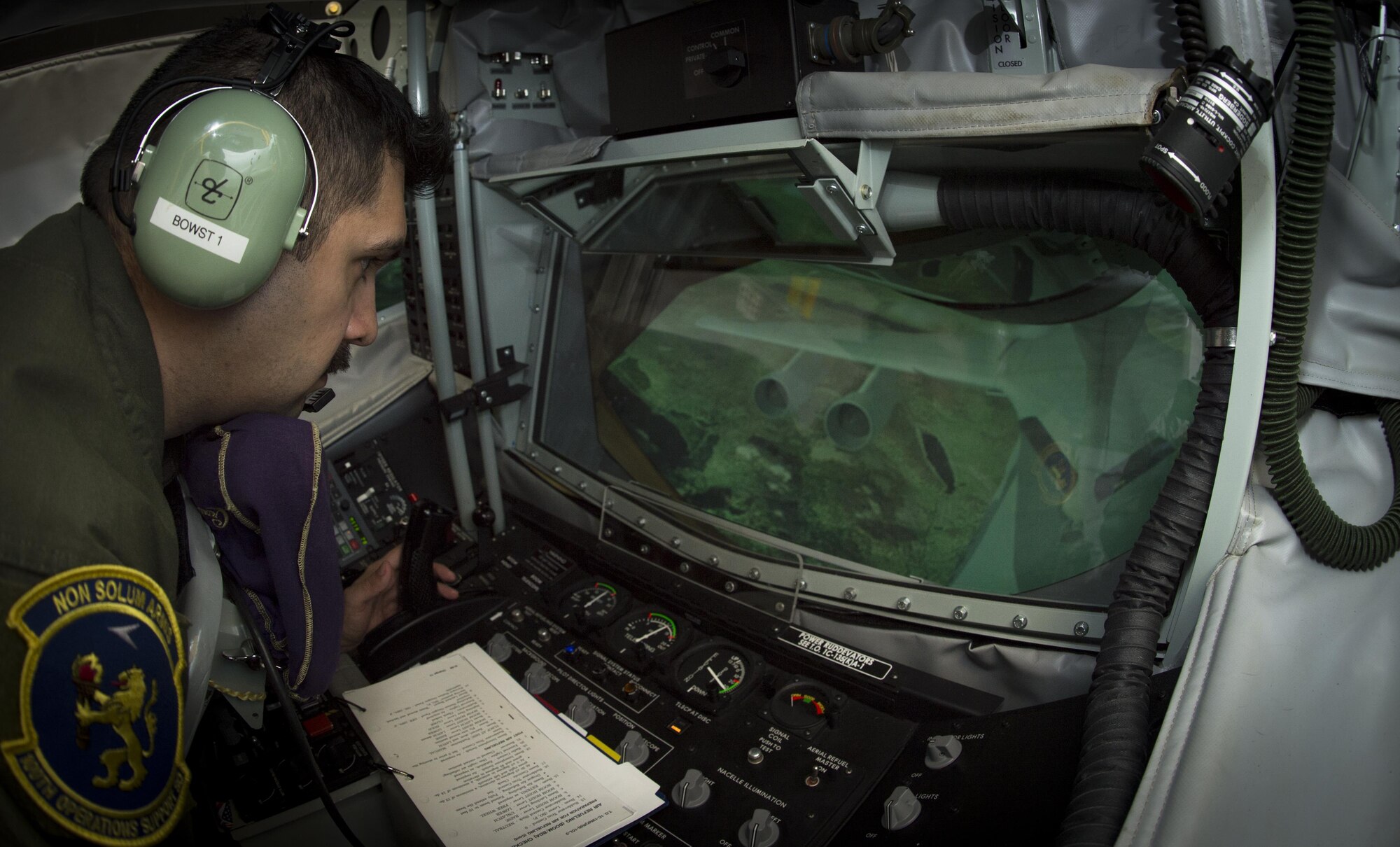 U.S. Air Force Tech. Sgt. Augie Marshall, wing scheduler assigned to the 100th Operations Support Squadron, operates the Boom Operator Weapons Systems Trainer, Nov. 9, 2017, at MacDill Air Force Base, Fla. The BOWST trains Airmen on normal procedures and on possible malfunctions during aerial refueling. (U.S. Air Force photo by Senior Airman Mariette Adams)