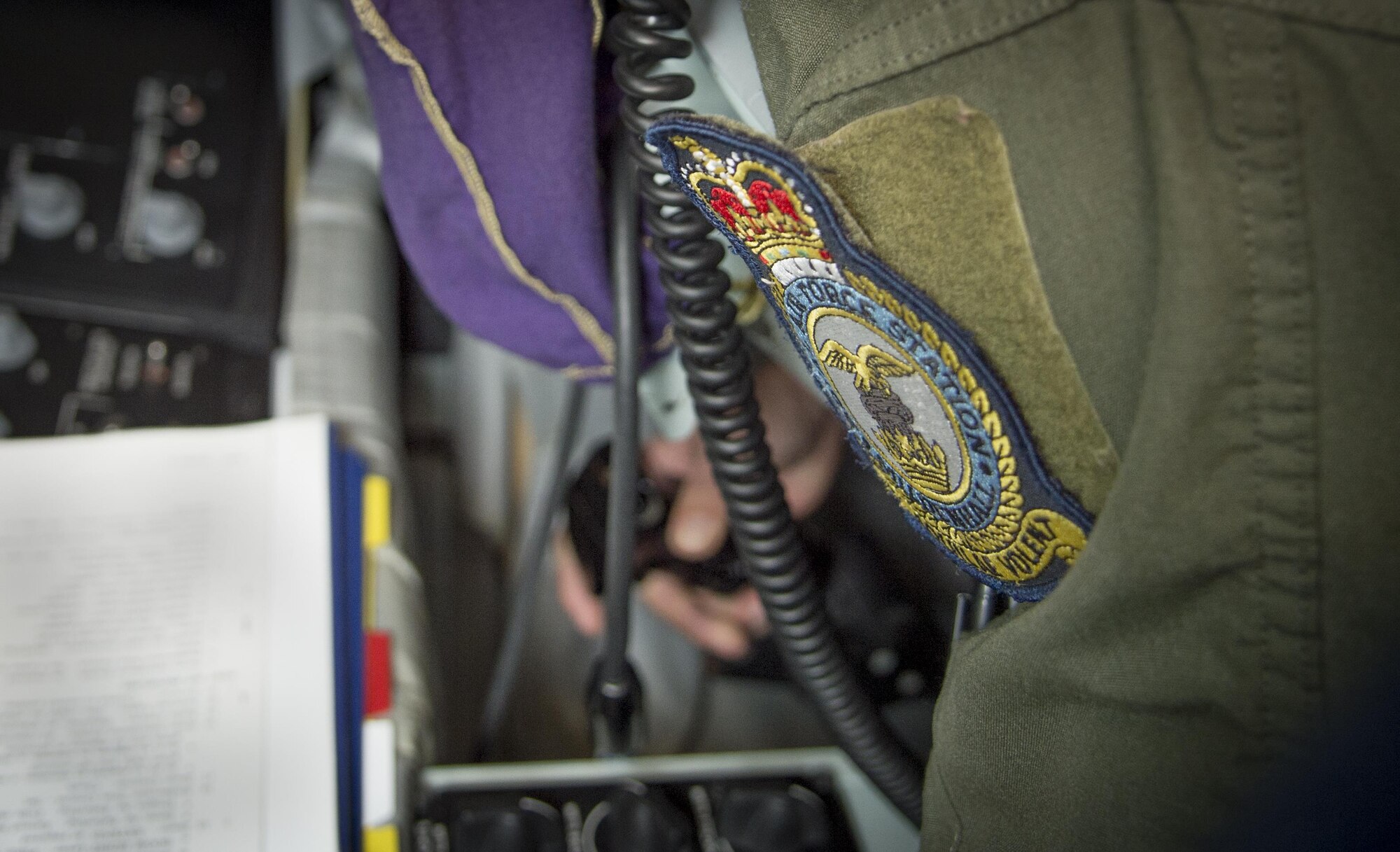 A Royal Air Force Mildenhall patch is attached to the flight suit of U.S. Air Force Tech. Sgt. Augie Marshall, wing scheduler assigned to the 100th Operations Support Squadron, as he operates the Boom Operator Weapons Systems Trainer (BOWST) Nov. 8, 2017, at MacDill Air Force Base, Fla. The BOWST creates a platform to instruct Airmen assigned to the MacDill BOWST to Airmen from around the world. (U.S. Air Force photo by Senior Airman Mariette Adams)