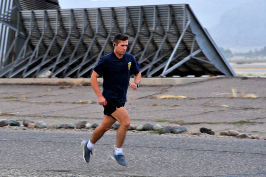 1st Lt. James Buckingham, 56th Civil Engineer Squadron engineer operations officer in charge, races towards the finish line of a 5K at Luke Air Force Base, Ariz., Nov. 17, 2017. Buckingham finished in first place with a time of 18:41. (U.S. Air Force photo/Airman 1st Class Pedro Mota)