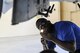 Senior Airman Rodney Brown, 74th Aircraft Maintenance Unit weapons load crew member, inspect a screw during a  quarterly weapons load competition, Nov. 16, 2017, at Moody Air Force Base, Ga. Judges evaluated the competitors based on dress and appearance, a knowledge exam and loading various munitions to determine the swiftest and most efficient load crew. (U.S. Air Force photo by Airman Eugene Oliver)