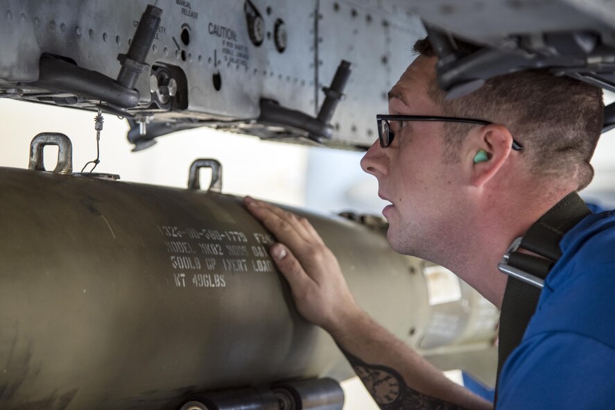 Staff Sgt. Jonathon Greg, 74th Aircraft Maintenance Unit crew chief, lines up a MK84 bomb on an A-10C Thunderbolt II during a quarterly weapons load competition, Nov. 16, 2017, at Moody Air Force Base, Ga. Judges evaluated the competitors based on dress and appearance, a knowledge exam and loading various munitions to determine the swiftest and most efficient load crew. (U.S. Air Force photo by Airman Eugene Oliver)