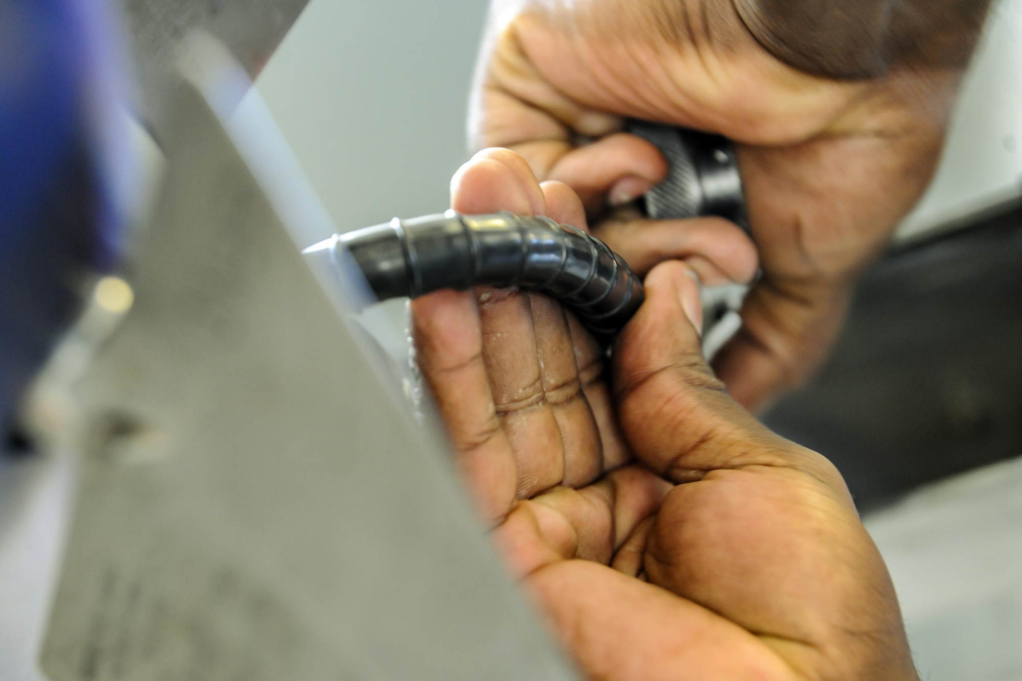 A weapons load member from the 74th Aircraft Maintenance Unit adjusts a component on an A-10C Thunderbolt II during the quarterly weapons load competition, Nov.16, 2017, at Moody Air Force Base, Ga. Judges evaluated the competitors based on dress and appearance, a knowledge exam and loading various munitions to determine the swiftest and most efficient load crew.  (U.S. Air Force photo by Airman Eugene Oliver)