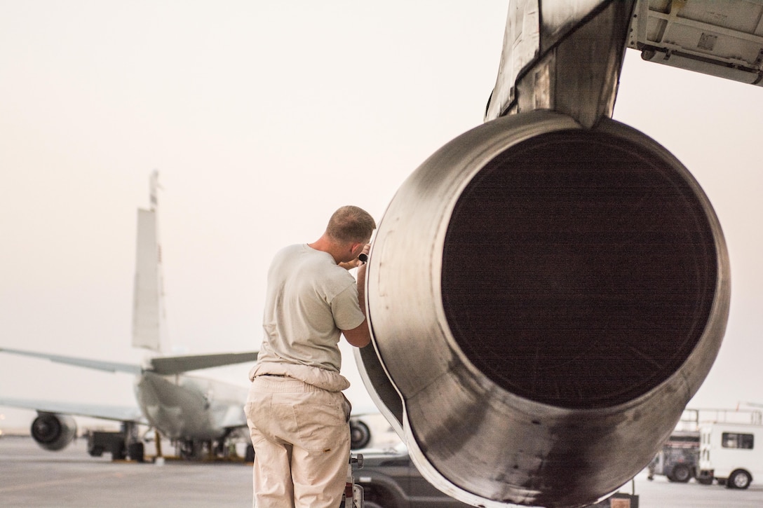 Air Force Staff Sgt. Daniel Spear performs a post-flight inspection of the intake and exhaust systems on an E-8C Joint Surveillance Target Attack Radar System.