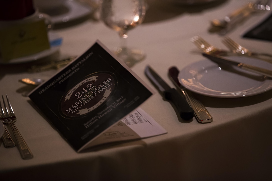 A program detailing the ceremony events is provided to each attendee of the Headquarters Battalion, Marine Corps Base Hawaii, 242nd Marine Corps Birthday Ball, at Hilton Hawaiian Village, Honolulu, Hawaii, Nov. 11, 2017. Each year Marines across the globe celebrate the date on which the Marine Corps was founded and the proud legacy that it's many years of existence has wrought. (U.S. Marine Corps photo by Sgt. Alex Kouns)