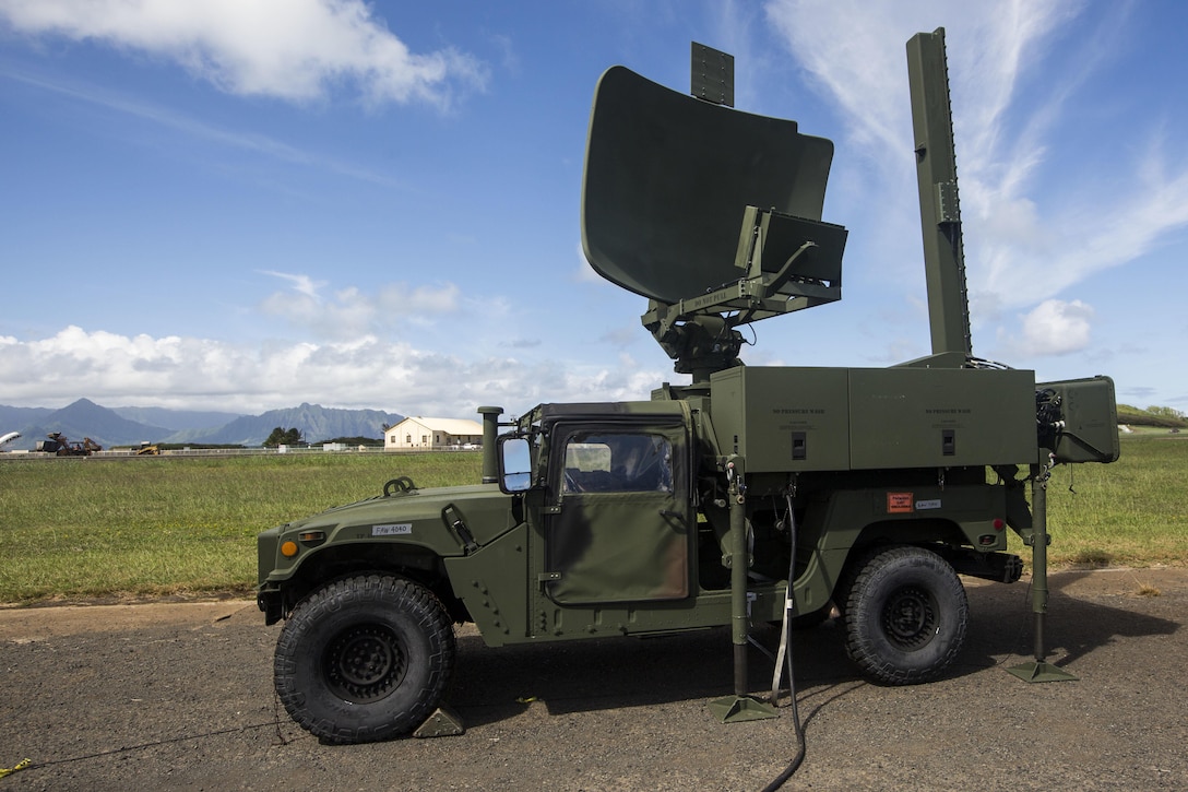 A Humvee assigned to Marine Air Traffic Control Detachment Alpha, Marine Air Control Squadron 4, carries a radar dish, Marine Corps Base Hawaii, Kaneohe Bay, Nov. 9, 2017. The unit will be providing air traffic control operations for MCBH, Kaneohe Bay, while the air station’s current radar equipment is under maintenance. (U.S. Marine Corps photo by Lance Cpl. Isabelo Tabanguil)