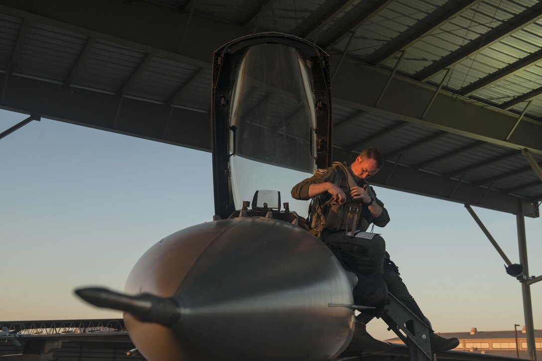 U.S. Air Force 1st Lt. Benjamin Shipley, 55th Fighter Squadron F-16CM Fighting Falcon pilot, prepares for flight atop his aircraft at Shaw Air Force Base, South Carolina, Nov. 16, 2017.