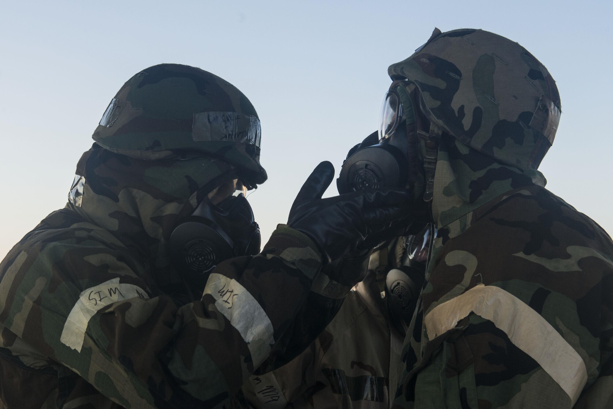 U.S. Airmen perform a buddy check during the first Rapid Ready Weasel exercise at Shaw Air Force Base, South Carolina, Nov. 16, 2017.