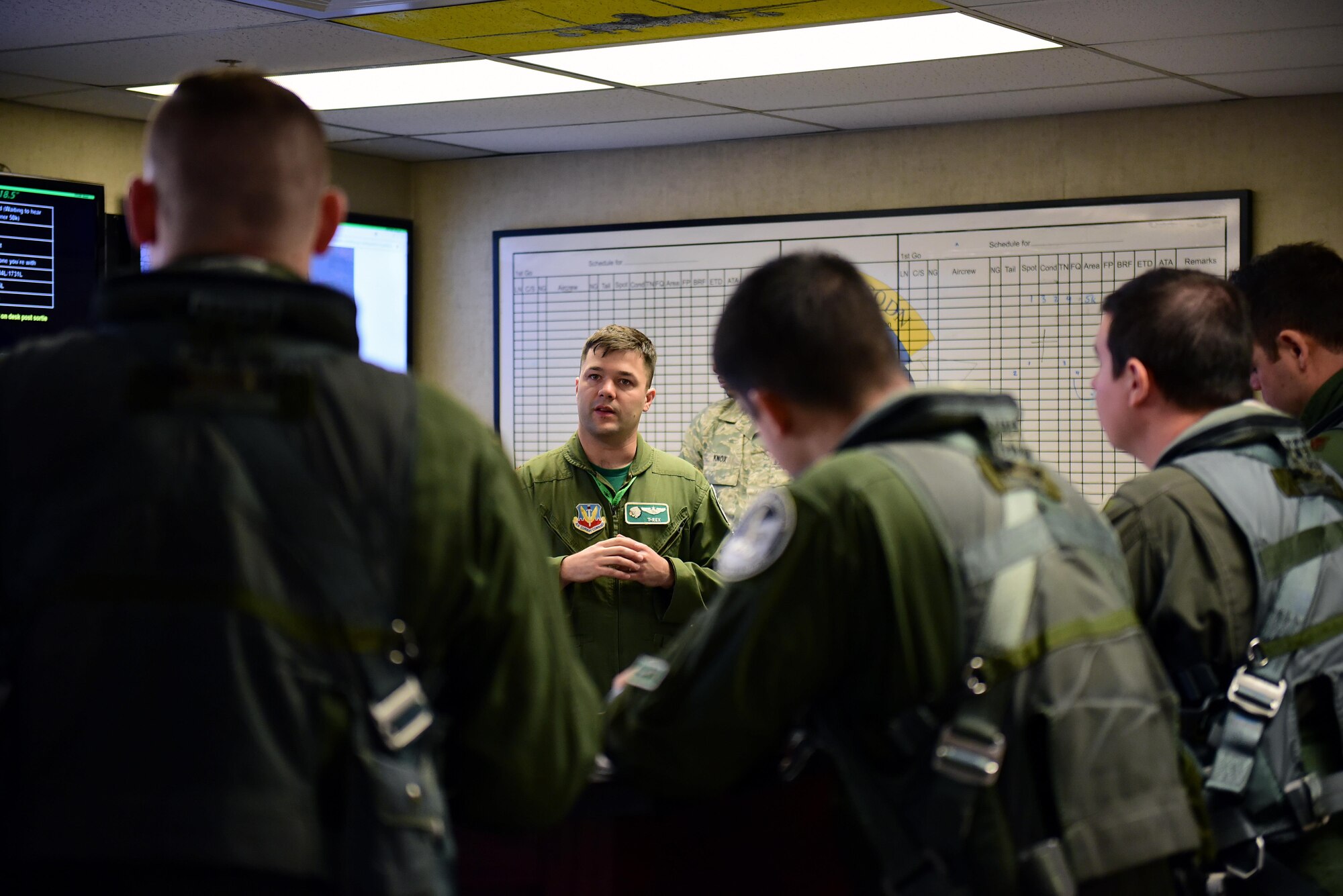 An F-15E Strike Eagle pilot with the 335th Fighter Squadron, updates the pilots participating in exercise Razor Talon before stepping, Nov. 17, 2017, at Seymour Johnson Air Force Base, North Carolina. The monthly exercise is an initiative developed by Seymour Johnson AFB to allow joint integration and training opportunities for all branches of the armed forces. (U.S. Air Force photo by Airman 1st Class Kenneth Boyton)