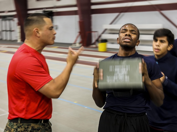 SUMMIT, Ill. — Sergeant Alexander Rodriguez, a drill instructor with Charlie Company, 1st Battalion, Charlie Company, Recruit Training Regiment, Marine Corps Recruit Depot Parris Island, S.C., yells at poolee during the Semper Fi Saturday at Argo Community High School in Summit, Illinois., Nov. 4. Semper Fi Saturday is an event that was created by the Marines of Recruiting Substation Oak Lawn in 2010,  to give high school students appreciation of the Marine Corps by giving them a first-hand experience into how Marines are made. (U.S. Marine Corps photo by Cpl. Quavaungh Pointer)