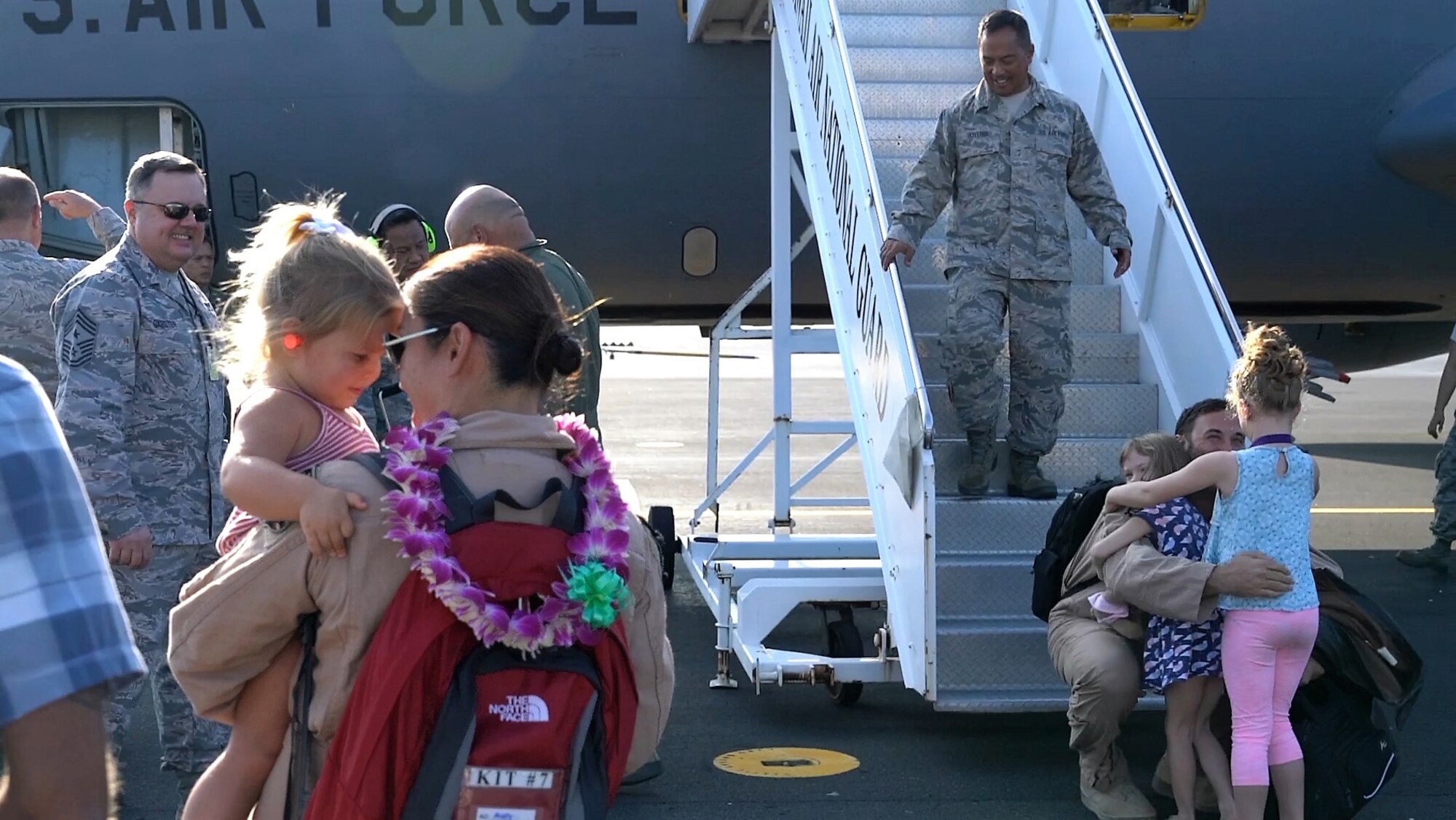 Airmen from the 203rd Air Refueling Squadron are greeted by family, friends, and fellow airmen upon returning home to Joint Base Pearl Harbor-Hickam, Hawaii.