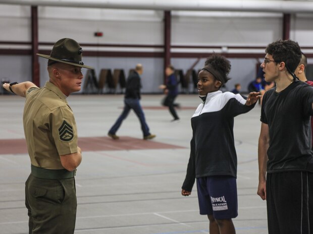 SUMMIT, Ill – Staff Sgt. Edward Baracree, a drill instructor with Kilo Company, 3rd Battalion, Recruit Training Regiment, Marine Corps Recruit Depot Parris Island, S.C., yells at student during the Semper Fi Saturday event in Summit, Illinois., Nov. 4. Semper Fi Saturday is an event that was created by the Marines of Recruiting Substation Oak Lawn in 2010,  to give high school students appreciation of the Marine Corps by giving them a first-hand experience into how Marines are made. (U.S. Marine Corps photo by Cpl. Quavaungh Pointer)