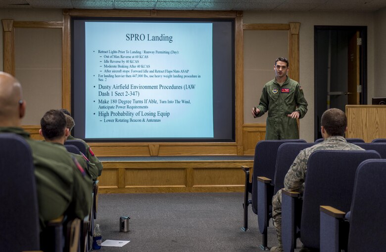 U.S. Air Force Capt. Jordan Novotny, an instructor pilot with the 58th Airlift Squadron briefs fellow aircrew members before the Altus Quarterly Exercise (ALTEX), Nov. 16, 2017 at Altus Air Force Base, Okla.