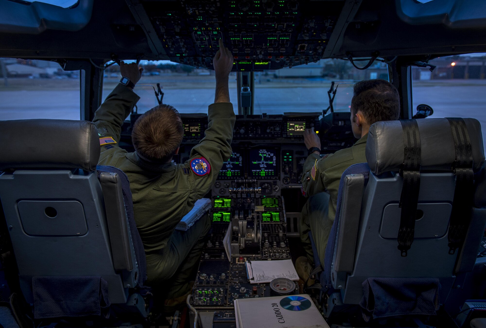 U.S. Air Force Capt. Eric Miller, an instructor pilot with the 97th Training Squadron and Maj. Chris Black, an instructor pilot with the 58th Airlift Squadron, perform pre-flight checks in a C-17 Globemaster III during the Altus Quarterly Exercise (ALTEX), Nov. 16, 2017 at Altus Air Force Base, Okla.
