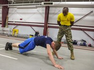 SUMMIT, Ill. – Staff Sgt. Dominique Young, a drill instructor with Fox Company, 2nd Battalion, Recruit Training Regiment, Marine Corps Recruit Depot Parris Island, S.C., yells at poolee during Semper Fi Saturday at Argo Community High School in Summit, Illinois, Nov. 4. Semper Fi Saturday is an event that was created by the Marines of Recruiting Substation Oak Lawn in 2010,  to give high school students appreciation of the Marine Corps by giving them a first-hand experience into how Marines are made. (U.S. Marine Corps photo by Cpl. Quavaungh Pointer)