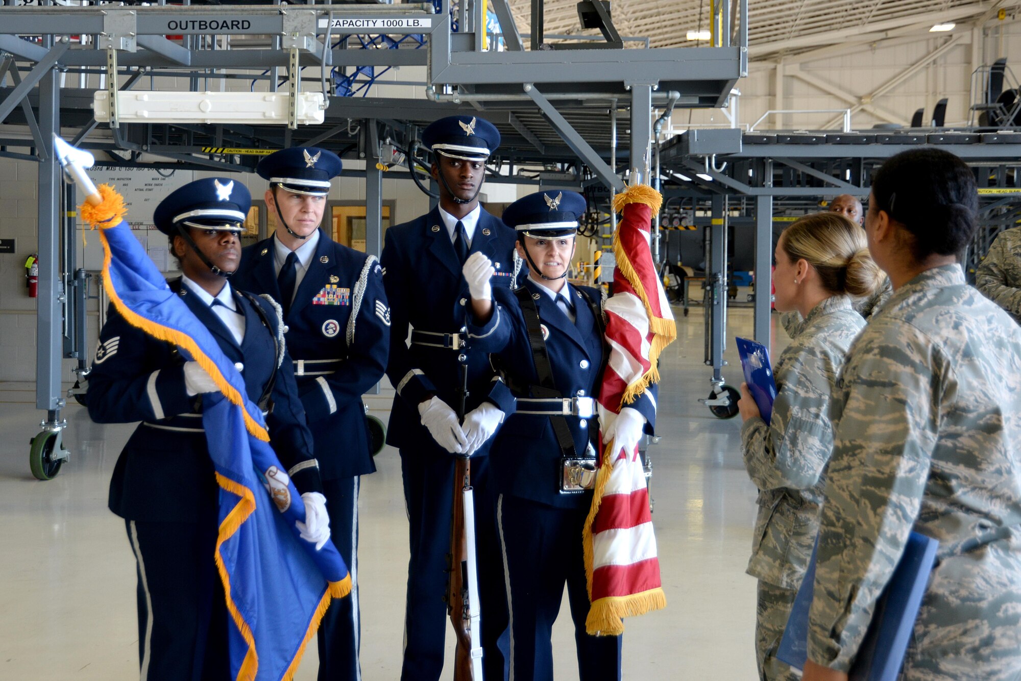 Keesler Air Force Base Honor Guardsmen clarify their marching route for the 22nd Air Force change of command ceremony with 81st Training Wing Protocol Office members in the isochronal dock Nov. 14, 2017, on Keesler Air Force Base, Mississippi. The Protocol Office is in charge of ensuring every ceremony on Keesler goes to plan according to Air Force standards. (U.S. Air Force photo by Airman 1st Class Suzanna Plotnikov)