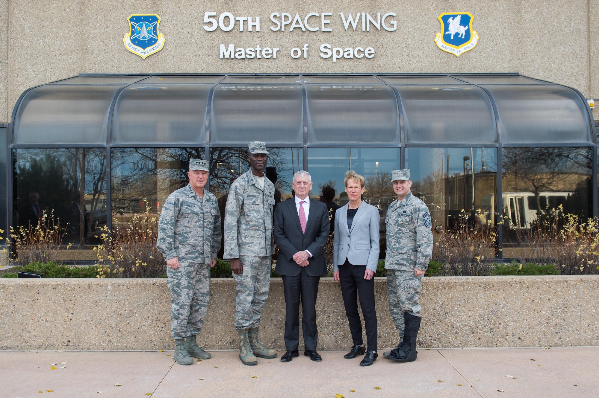 SCHRIEVER AIR FORCE BASE, Colo.—Secretary of Defense Jim Mattis (center) stands with Gen. Jay Raymond, Air Force Space Command commander (far left), Col. Jacob Middleton, 50th Space Wing vice commander (second from left), Betty Sapp, National Reconnaissance Office director (second from right) and Chief Master Sgt. Jason Tiek, 50th SW Command Chief Master Sergeant (far right) in front of the 50th SW headquarters at Schriever Air Force Base, Colo., Nov. 16, 2017.  Mattis stopped by Schriever AFB after visiting Headquarters North American Aerospace Defense Command and U.S. Northern Command as part of his one-day trip to Colorado Springs. (U.S. Air Force photo by Dennis Rogers)