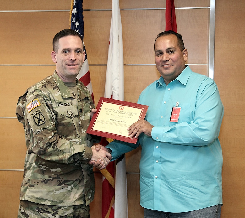 Lt. Col. Peter Stambersky, Los Angeles District deputy commander, presents Walter Ahhaitty, planner and grant writer for Southern California Indian Center Inc. of Orange County, California, with a certificate of appreciation following Ahhaitty's presentation as the keynote speaker at the District's National Native American Heritage Month Observance Nov. 7 at the District headquarters in downtown LA.