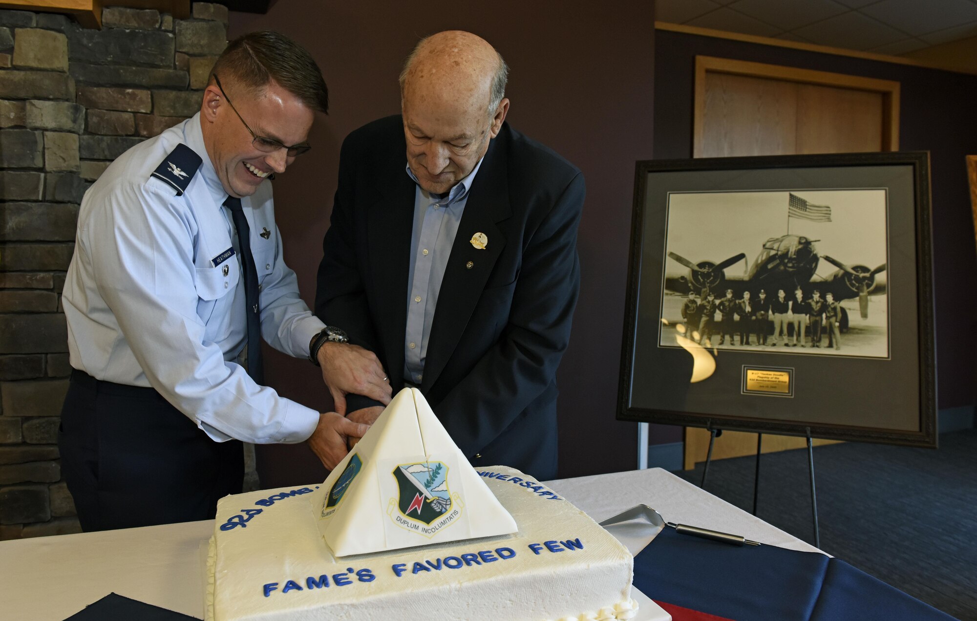 (left) Colonel J. Scot Heathman, 92nd Air Refueling Wing vice commander, and (right) Duane Wolfe, 92nd ARW Memorial Association president, cut a cake to commemorate the wing’s 70th anniversary at Fairchild Air force Base, Wash., Nov. 17, 2017. The 92nd ARW has proven critical to fulfilling U.S. Strategic Command’s vision of fighting and delivering integrated, multi-domain combat effects across the globe, wherever and whenever needed. (U.S. Air Force photo /Airman 1st Class Jesenia Landaverde)
