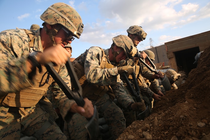 Combat engineers with Engineer Support Company, Combat Logistics Battalion 3, Combat Logistics Regiment 3, dig a trench while building an underground bunker, Oct. 28, 2017 at Rodriguez Live Fire Range, Paju, South Korea. The Marines with CLB-3 built an expeditionary base on the range to remain as a standing capability for future units that rotate through the training area. The base was built as a part of Exercise Winter Workhorse 17/ Korean Marine Exchange Program 18.1, which familiarizes the American armed forces with the Korean Peninsula and builds upon an enduring alliance between the two militaries. (U.S. Marine Corps photo by Sgt. Tiffany Edwards)