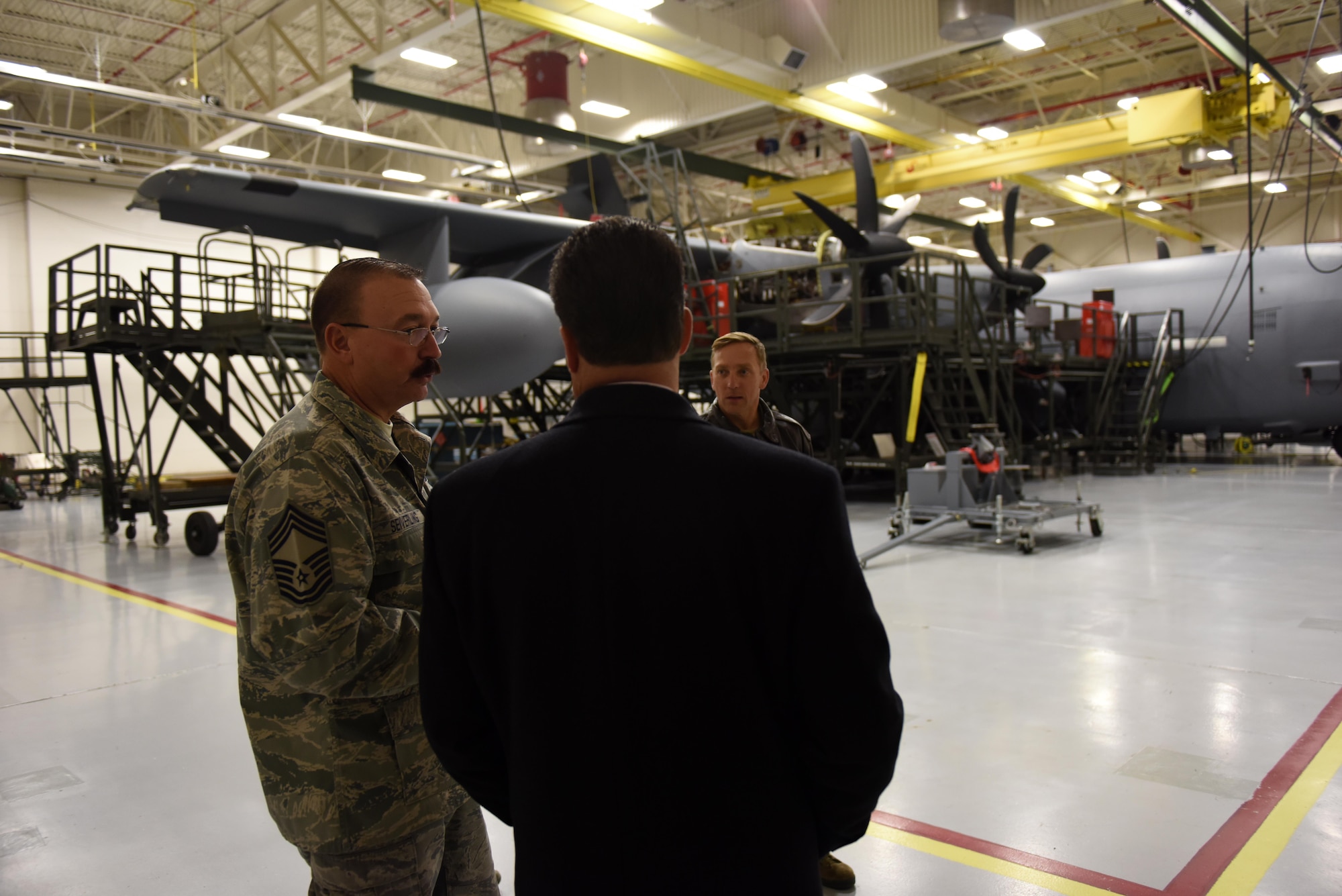 State Rep. Mehaffie presents citation to Airman, tours base