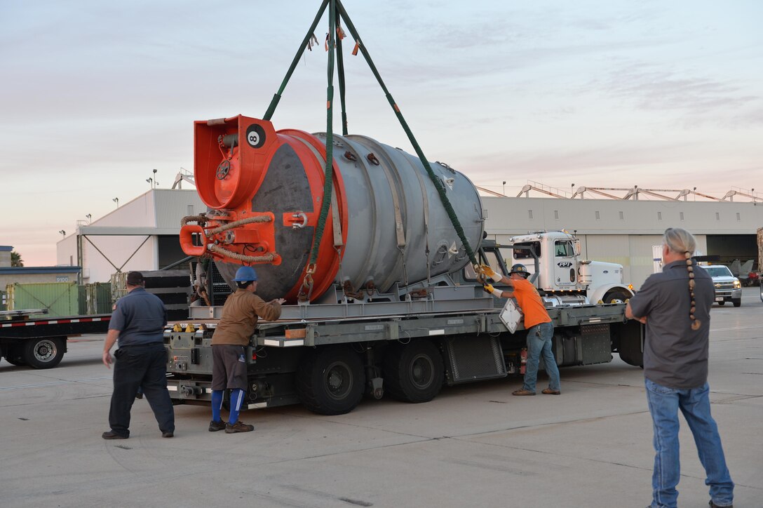 A Submarine Rescue Chamber is hoisted off a truck.