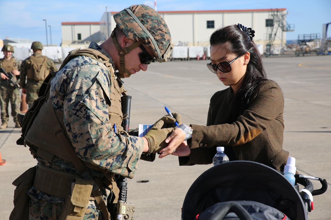 A U.S. Marine assigned to Special Purpose Marine Air-Ground Task Force-Crisis Response-Africa processes a notional evacuee during non-combatant evacuation operation training aboard Naval Air Station Sigonella, Italy, on Nov. 17, 2017. SPMAGTF-CR-AF deployed to conduct limited crisis-response and theater-security operation in Europe and Africa.