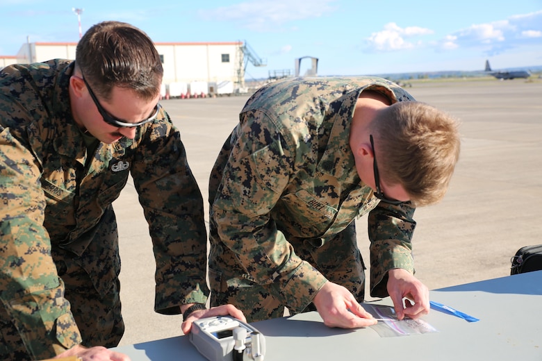 Explosive Ordnance Disposal technicians assigned to Special Purpose Marine Air-Ground Task Force-Crisis Response-Africa inspect a suspicious object during non-combatant evacuation operation training aboard Naval Air Station Sigonella, Italy, on Nov. 17, 2017. SPMAGTF-CR-AF deployed to conduct limited crisis-response and theater-security operation in Europe and Africa.