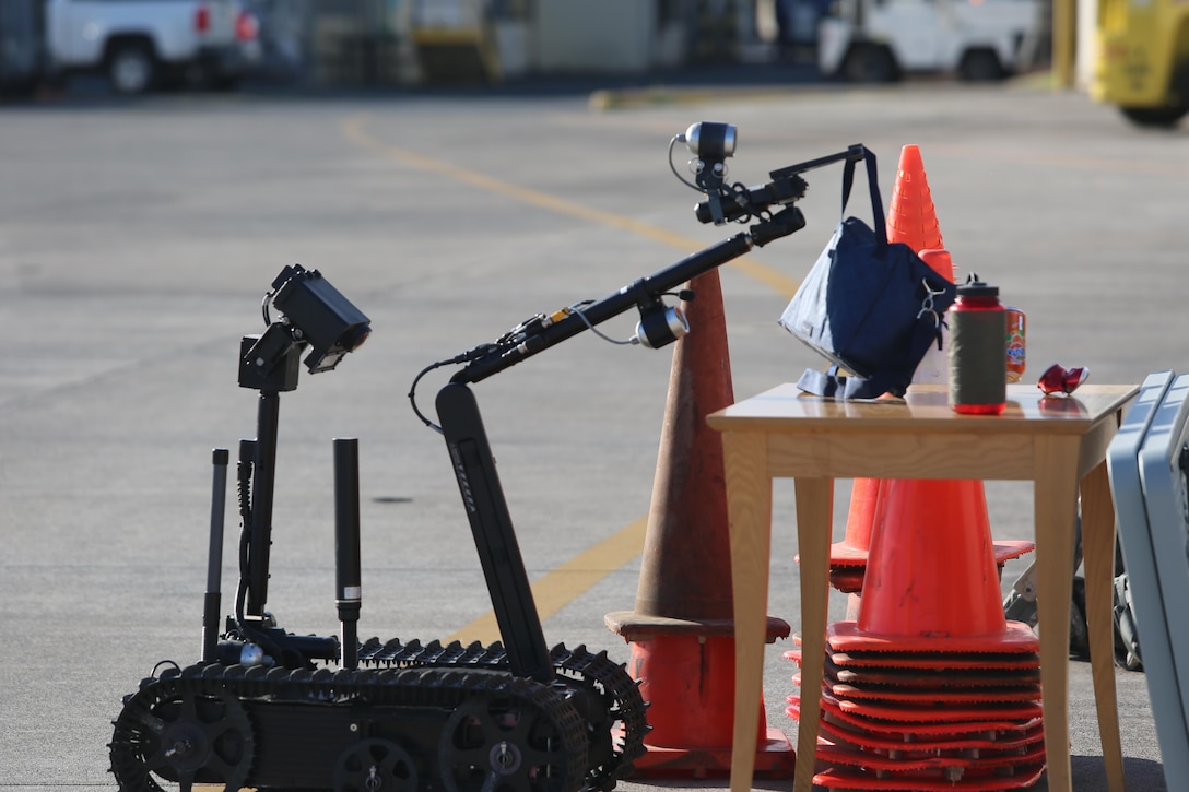 A bomb disposal robot inspects a suspicious object during non-combatant evacuation operation training aboard Naval Air Station Sigonella, Italy, on Nov. 17, 2017. SPMAGTF-CR-AF deployed to conduct limited crisis-response and theater-security operation in Europe and Africa.