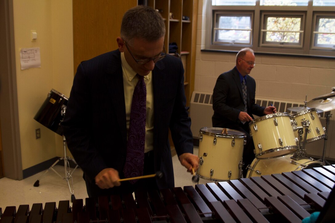 U.S. Marine Corps Gunnery Sgt. Jonathan Bisesi, left, plays the xylophone while U.S. Marine Corps Master Sgt. Glenn Paulson plays the drums at Clinton High School Oct. 10, 2017, in Utica, N.Y. During their October north east tour, the band played at Stanley Theater in Utica. Bisesi and Paulson, both percussionists with the United States Marine Band, came to speak with high school students on behalf of the band about their experiences as professional musicians.