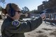 U.S. Air Force Capt. Maggie R. Linn, C-17 Globemaster III Pilot, 732nd Airlift Squadron, 514th Air Mobility Wing, fires an M9 pistol