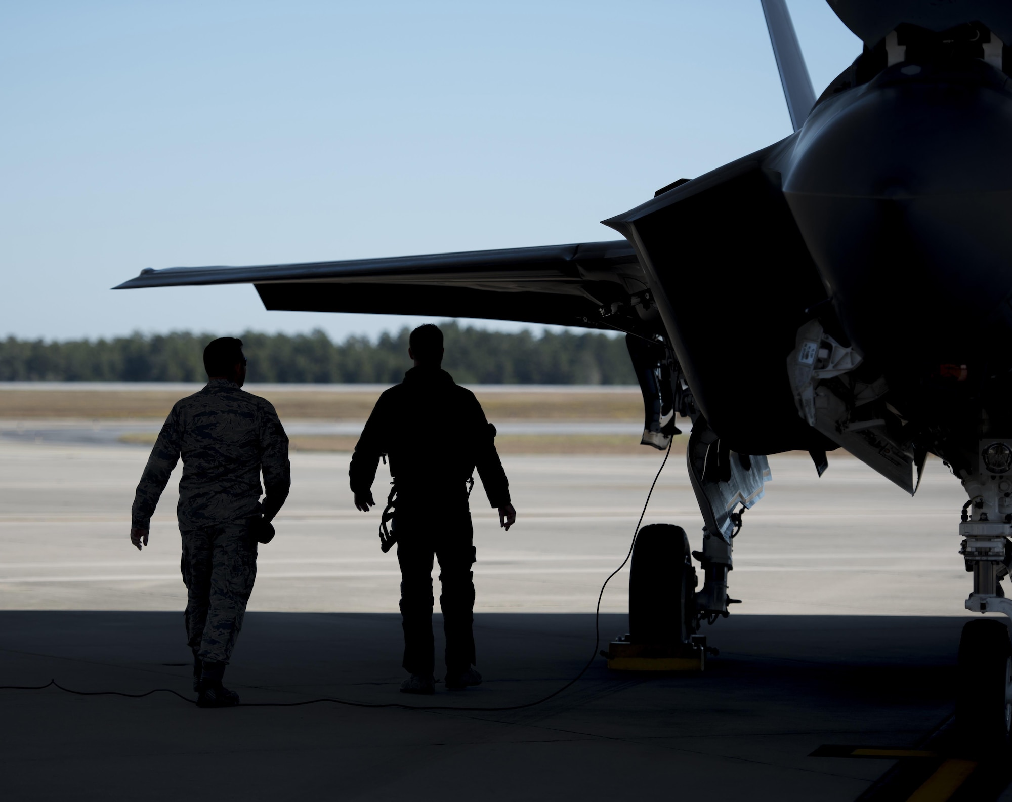 U.S. Air Force Staff Sgt. Jon Peek, 58th Aircraft Maintenance Unit crew chief, left, and Lt. Col. Jared Santos, 513th Electronic Warfare Squadron commander, inspect an F-35A Lightning II assigned to the 33rd Fighter Wing prior to a sortie Nov. 14, 2017, at Eglin Air Force Base, Fla. The 33 FW supported Checkered Flag 18-1 from home station. Checkered Flag is a large scale air-to-air only exercise that emphasizes the execution and production of tactics between fourth and fifth generation aircraft. (U.S. Air Force photo by Staff Sgt. Peter Thompson/Released)