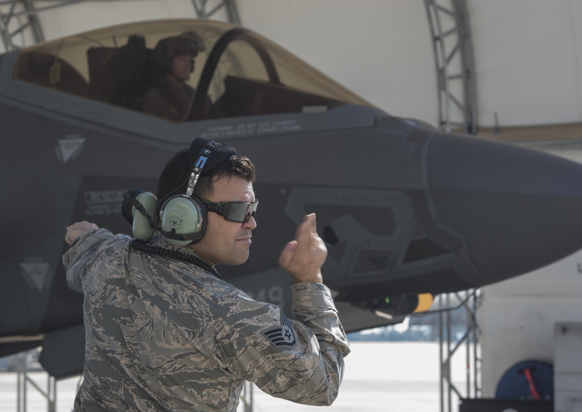 U.S. Air Force Staff Sgt. Jon Peek, 58th Aircraft Maintenance Unit crew chief, marshals an F-35A Lightning II from the 33rd Fighter Wing Nov. 14, 2017, at Eglin Air Force Base, Fla. The 33 FW supported Checkered Flag 18-1, a large scale air-to-air only exercise that emphasizes the execution and production of tactics between fourth and fifth generation aircraft. Checkered Flag is one of the few exercises where fifth generation aircraft participate as aggressors, allowing for realistic training against peer-like adversaries. (U.S. Air Force photo by Staff Sgt. Peter Thompson/Released)