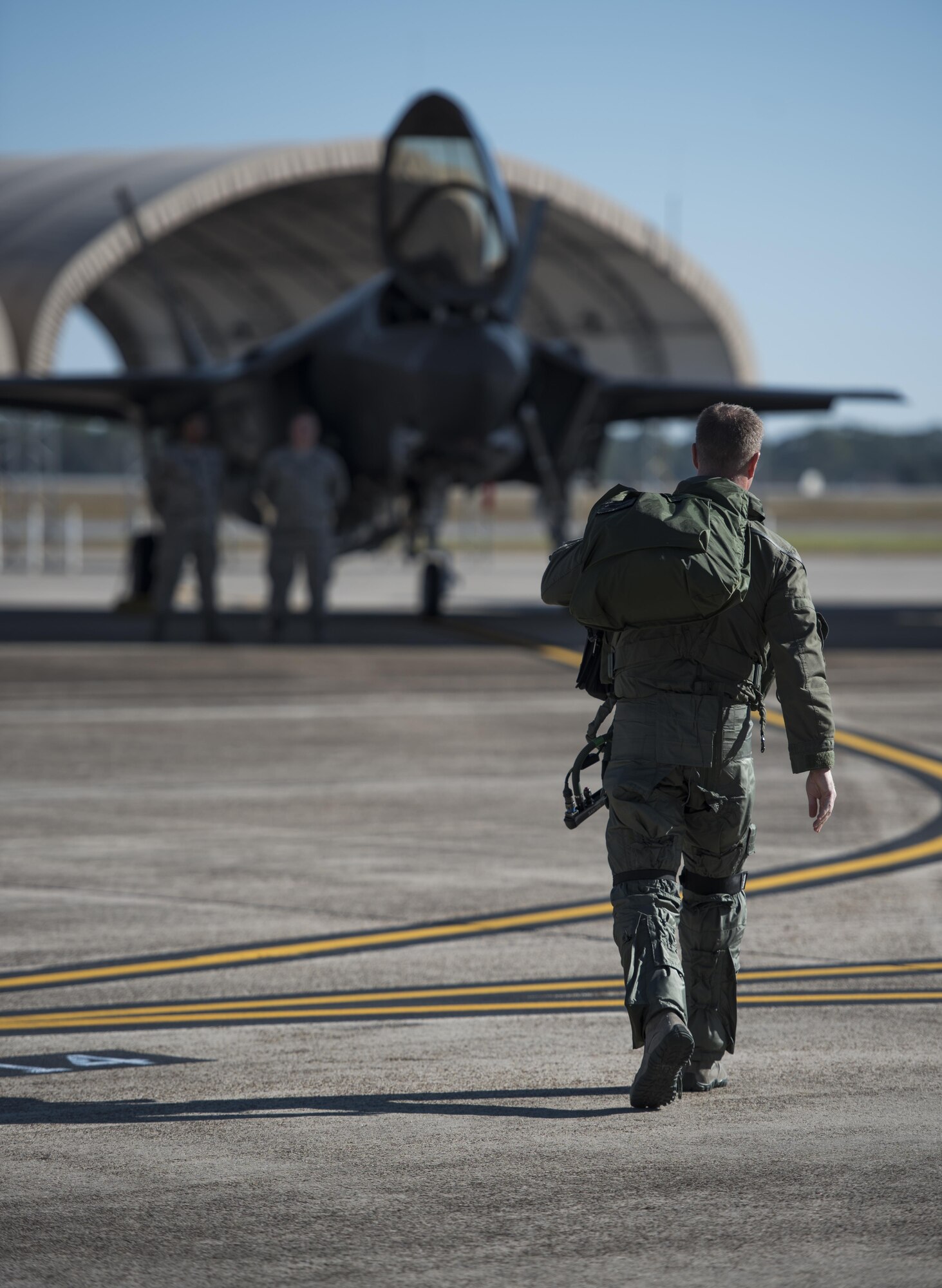 U.S. Air Force Lt. Col. Jared Santos, 513th Electronic Warfare Squadron commander, walks to an F-35A Lightning II Nov. 14, 2017, at Eglin Air Force Base, Fla. The 33rd Fighter Wing supported Checkered Flag 18-1 from home station. The wing launched 44 sorties in conjunction with the on-going F-35 pilot training here. (U.S. Air Force photo by Staff Sgt. Peter Thompson/Released)