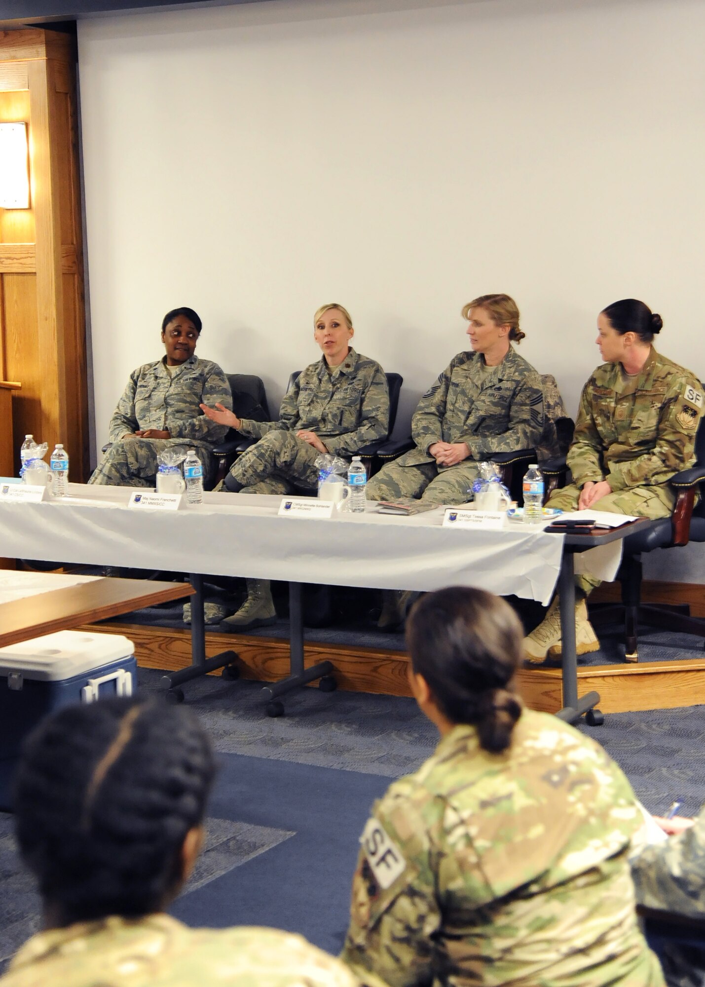 From left to right, Lt. Col. LaShauna Lindsey, 341st Communications Squadron commander; Maj. Naomi Franchetti, 341st Missile Maintenance Squadron commander; Chief Master Sgt. Minnette Bohlander, 341st Maintenance Group superintendent; and Senior Master Sgt. Tessa Fontaine, 341st Security Support Squadron security forces manager, discuss a topic during the first “Let’s Connect” event Nov. 16, 2017, at Malmstrom Air Force Base, Mont. “Let’s Connect” is a professional development directed primarily toward females but is open to anyone to help individuals understand their peers, leaders and subordinates better. (U.S. Air Force photo by Christy Mason)