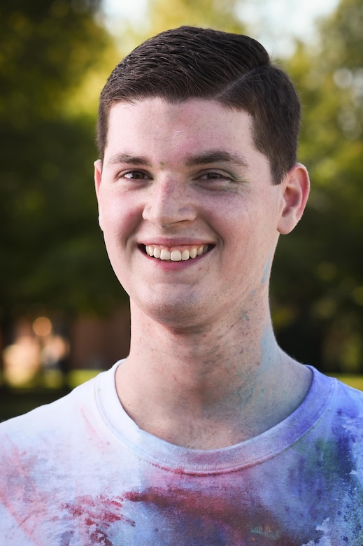 U.S. Air Force Airman Calum Green, 633rd Comptroller Squadron travel pay technician, poses for a photo after a resiliency color run at Joint Base Langley-Eustis, Va., Oct. 20, 2017.