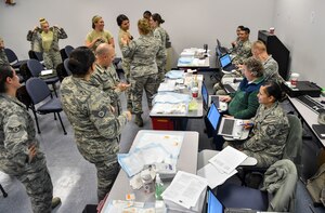 Joint Base Charleston members process through the point of distribution line during a mass-immunization exercise at Joint Base Charleston, S.C., Nov. 15, 2017.