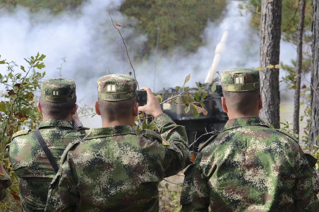 Colombian army leaders observe a live-fire exercise with the M109A6 Paladin 155 mm howitzer during a visit to the South Carolina Army National Guard’s 1st Battalion, 178th Field Artillery Regiment, at the McCrady Training Center in Eastover, S.C., Nov. 18, 2017. Colombia and South Carolina are partnered in the State Partnership Program, and the Colombian army is seeking to build up its field artillery program. South Carolina Army National Guard photo by Spc. Chelsea Baker