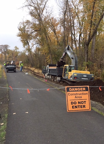 Contractors remove roots and stumps that were intruding into the Mill Creek levee. The U.S. Army Corps of Engineers manages the first mile of the Mill Creek Levee System, Mill Creek Dam and Bennington Lake, located east of Walla Walla, Washington, city limits.