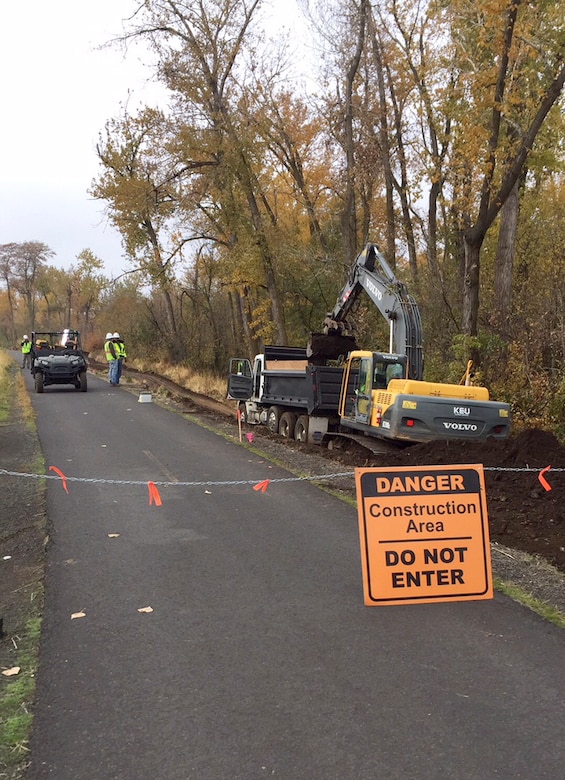 Contractors remove roots and stumps that were intruding into the Mill Creek levee. The U.S. Army Corps of Engineers manages the first mile of the Mill Creek Levee System, Mill Creek Dam and Bennington Lake, located east of Walla Walla, Washington, city limits.