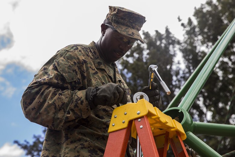 Staff Sgt. Peter Parris helps assemble playground equipment during a construction project at Kamuela, on the island of Hawaii, Oct. 28, 2017. Parris is a motor transport operations chief with Combat Logistics Battalion 3, and a native of Brooklyn, N.Y. U.S. Marines with CLB-3 are helping rebuild a local community playground alongside volunteers from Kamuela. (U.S. Marine Corps photo by Lance Cpl. Isabelo Tabanguil)