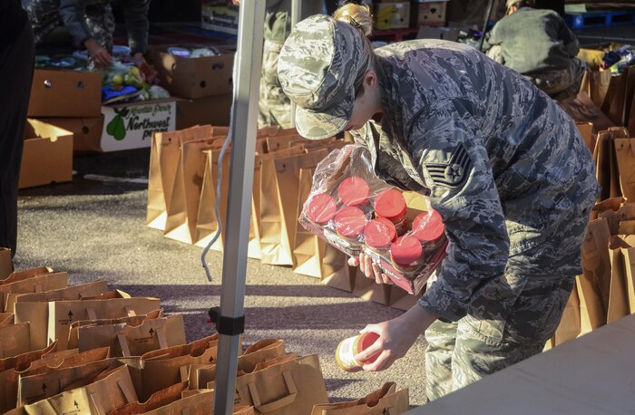 A Joint Base Charleston Airman packs lunches during a mobile food drive for Veteran’s day in Charleston, S.C., Nov. 10, 2017.