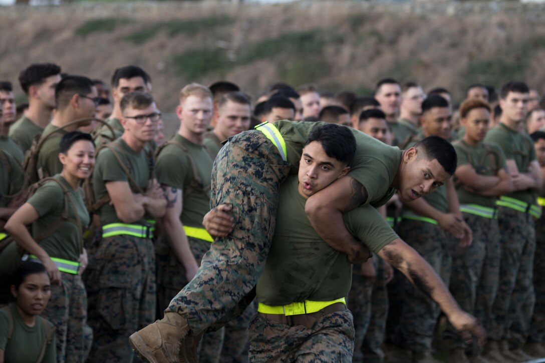 Marines conduct fireman's carry drills during the 2017 Commanding General’s Cup competition on Camp Pendleton, Calif.
