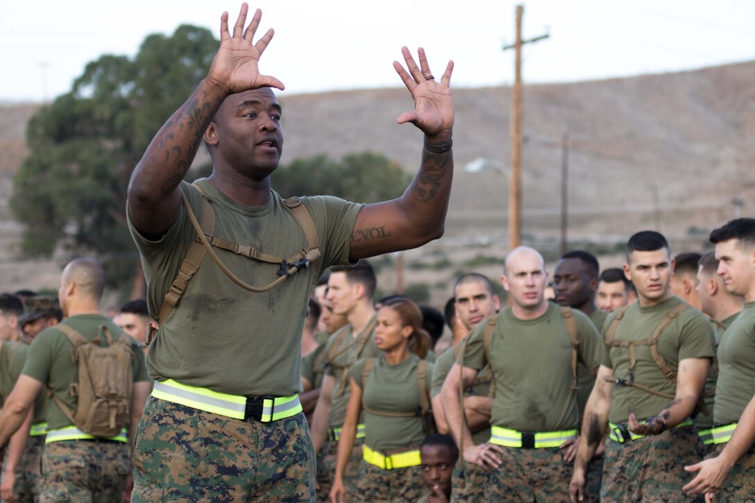 Marine Corps Sgt. Maj. Auburne Edwards, 1st Maintenance Battalion, 1st Marine Logistics Group, signals other Marines during the 2017 Commanding General’s Cup competition at Camp Pendleton, Calif.