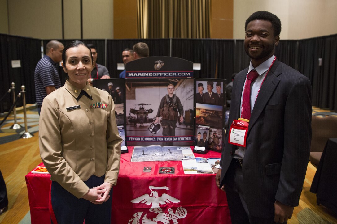 U.S. Marine Corps Maj. Jessica Shearer, Communication Officer, 4th Medical Battalion, 4th Marine Logistics Group, interviews students at the National Society of Black Engineers Symposium in Garden Grove, Calif., November 18, 2017. During the symposium Marines interact with collegiate-level students from across the country whom have shown outstanding qualities in education and leadership. By investing in a diverse and representative officer corps, it will help generate and sustain a future force that has the cultural expertise, language skills, and a variety of philosophies needed to meet the operational requirements of the Marine Corps. (U.S. Marine Corps photo by Lance Cpl. Jesus McCloud/Released)