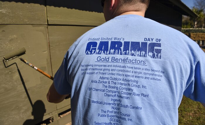 Machinist Mate Bryan Davis, Naval Nuclear Power Training Command fireman, paints a Vietnam memorial exhibit during Day of Caring at Patriot’s Point, Mount Pleasant, S.C., Nov. 17, 2017.
