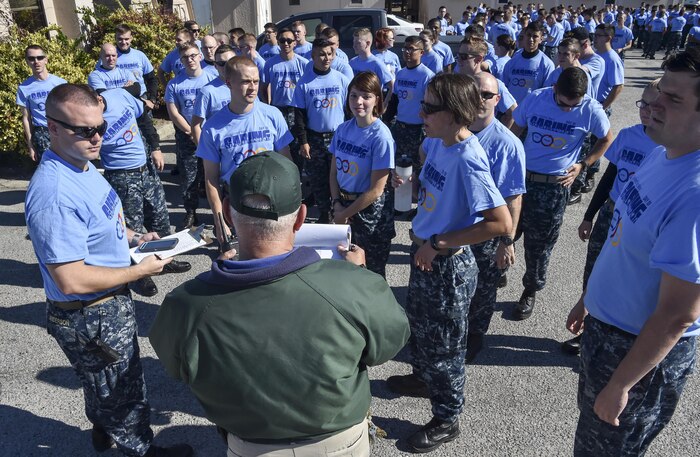 Joint Base Charleston members gather for instructions during the Day of Caring volunteer event at Patriot’s Point, Mount Pleasant, S.C., Nov. 17, 2017.
