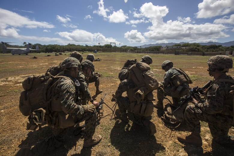 U.S. Marines prepare to move out and secure the area during a Tactical Recovery of Aircraft and Personnel training event. The Marines are with 2nd Battalion, 3rd Marine Regiment, and are conducting a TRAP training event in Exercise Bougainville II at Landing Zone Boondocker, Marine Corps Base Hawaii, on Oct. 26, 2017. Exercise Bougainville II prepares 2nd Bn., 3rd Marines for service as a forward deployed force in the Pacific by training them to fight as a ground combat element in a Marine Air-Ground Task Force. (U.S. Marine Corps photo by Lance Cpl. Isabelo Tabanguil)