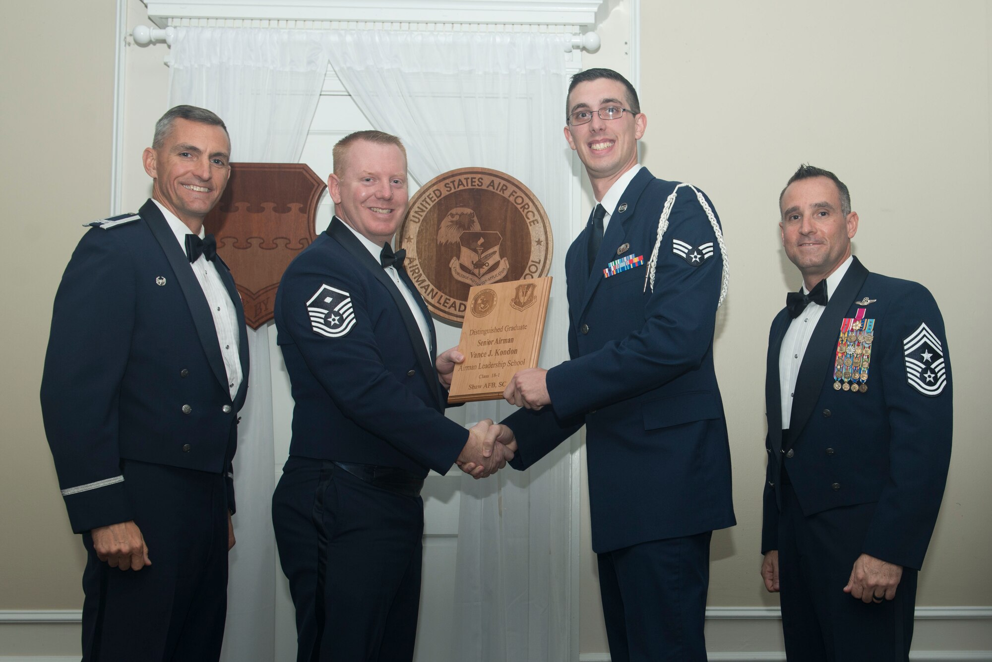 U.S. Air Force Senior Airman Vance Kondon, 3rd Intelligence Squadron, receives a distinguished graduate award for Class 18-1 of the Senior Master Sgt. David B. Reid Airman Leadership School, at Shaw Air Force Base, South Carolina, Nov. 17, 2017.