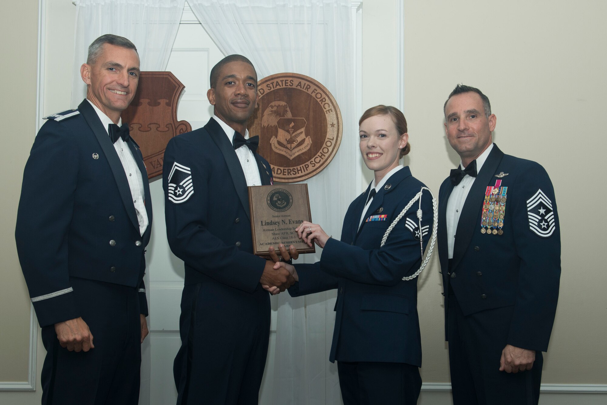 U.S. Air Force Senior Airman Lindsey Evans, 3rd Intelligence Squadron, receives the Senior Master Sgt. David B. Reid Airman Leadership School (ALS) Academic Achievement award during the ALS Class 18-1 graduation ceremony at Shaw Air Force Base, South Carolina, Nov. 17, 2017.