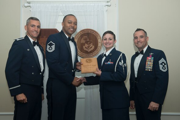 U.S. Air Force Senior Airman Cassandra Pease, 20th Aerospace Medical Squadron, receives the Senior Master Sgt. David B. Reid Airman Leadership School (ALS) Commandant’s Award during the ALS Class 18-1 graduation ceremony at Shaw Air Force Base, South Carolina, Nov. 17, 2017.
